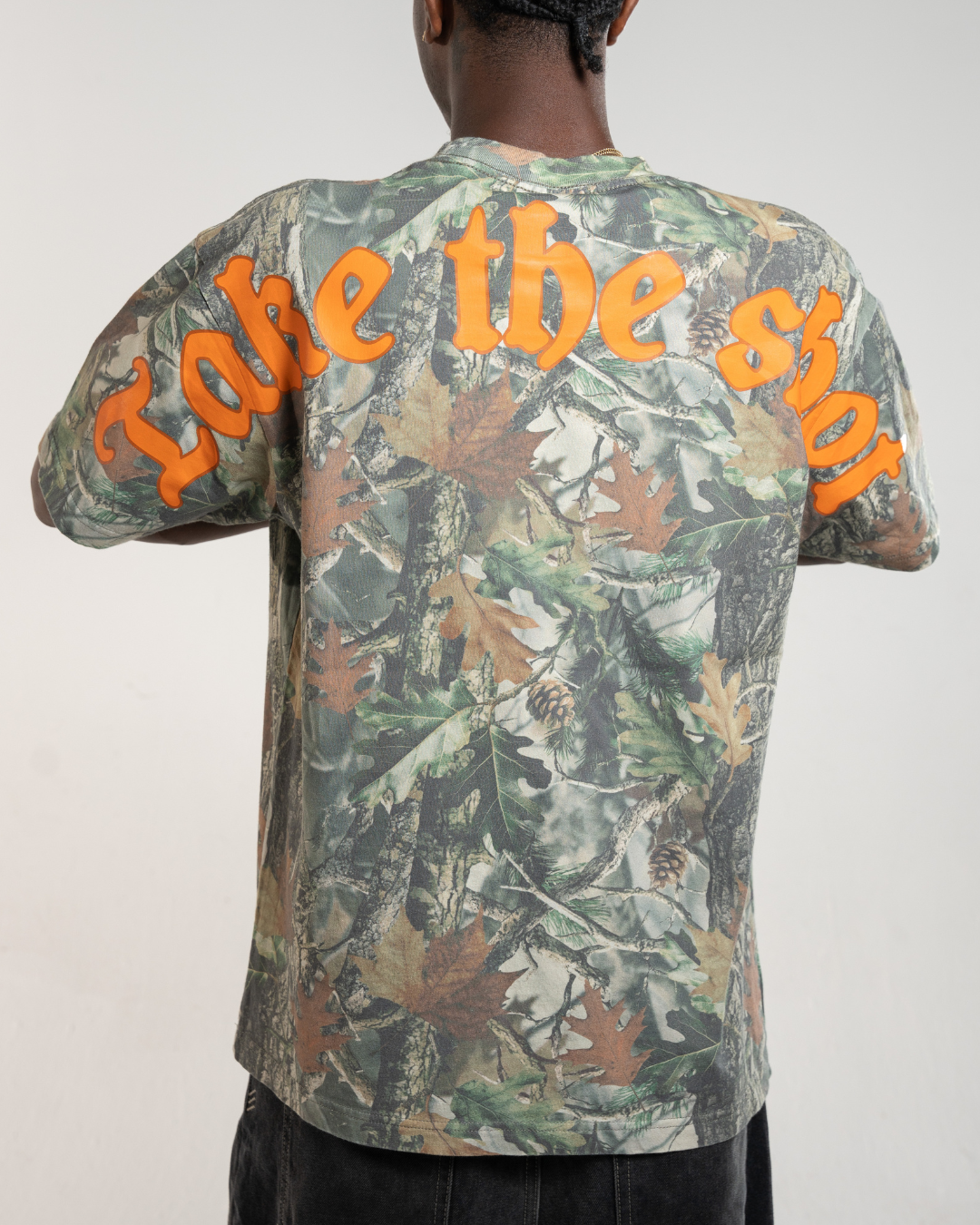 Back of forest camo tee showing Blacktop Ranch streetwear graphic design