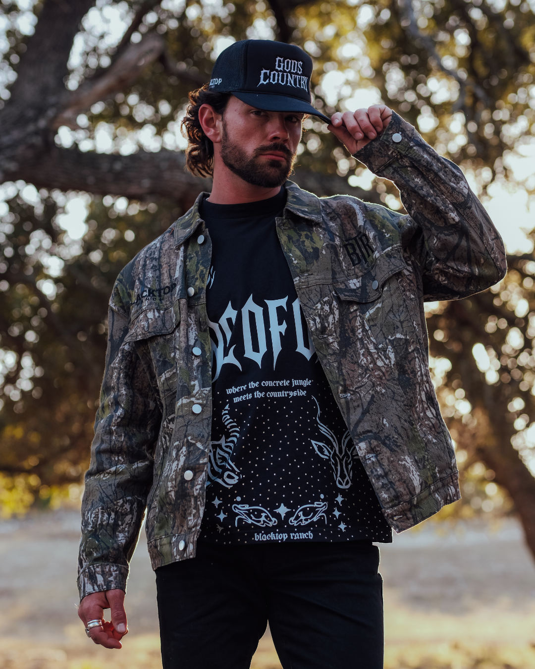 Western streetwear outfit featuring twig camo denim jacket Blacktop Ranch