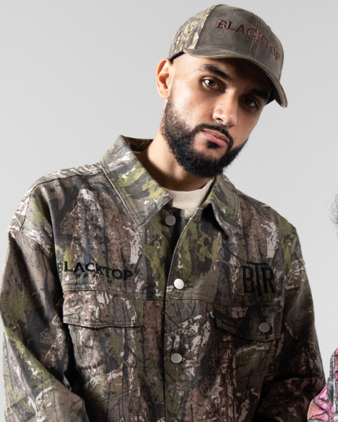 Blacktop Ranch camo hat with distressed vintage-style fabric and western streetwear design