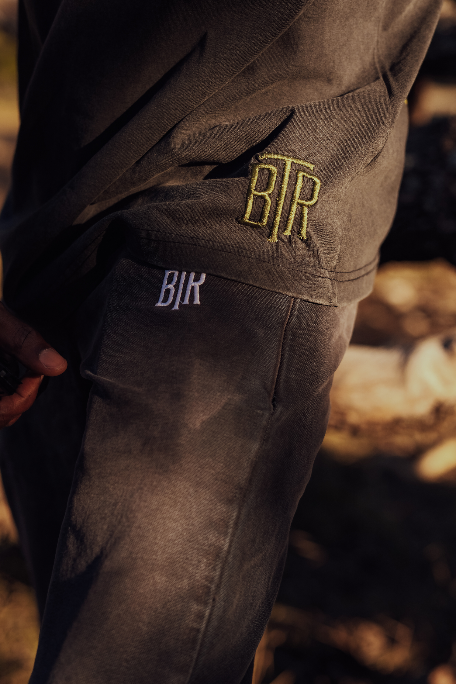 Close-up of vintage washed fabric and BTR stitching on bottom of the shirt 