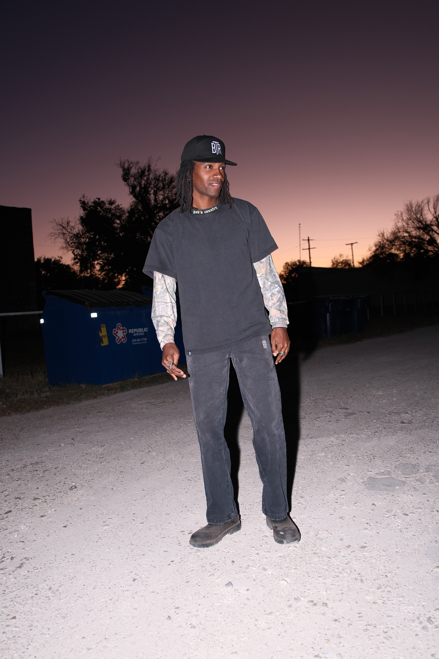 Western inspired streetwear outfit featuring Blacktop Ranch washed camo long sleeve