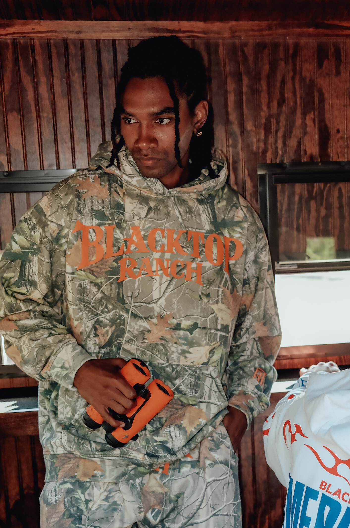 Forest camo hoodie styled in western streetwear Blacktop Ranch Take The Shot