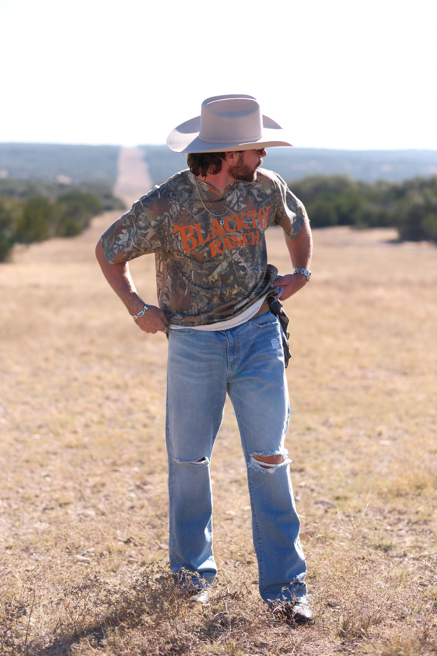Blacktop Ranch BTR bootleg denim pants styled in outdoor lifestyle setting